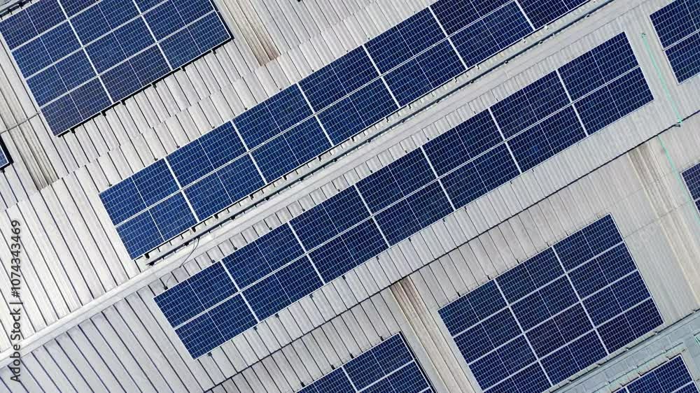4K Aerial view of solar energy on the roofs of industrial plants by the drone during the evening. 4K Aerial view of solar energy on the roofs of industrial plants by the drone during the evening.