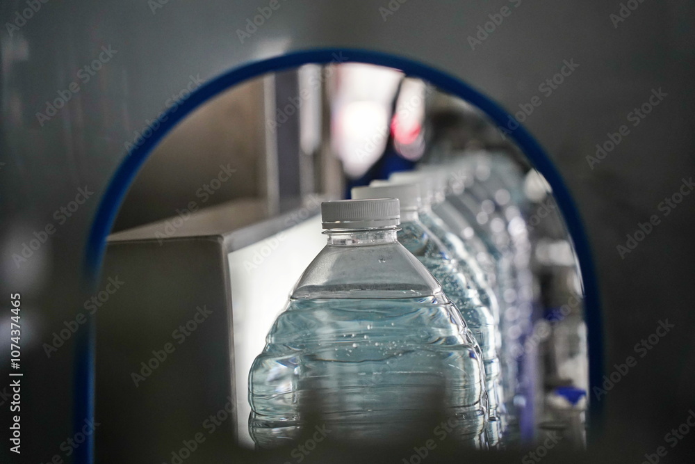 Bottled water on a conveyor belt at the factory. Bottled water on a conveyor belt at the factory.