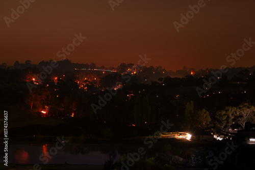 Wallpaper Mural Night landscape with scattered lights resembling fires, creating a mysterious and moody atmosphere in a rural setting Torontodigital.ca