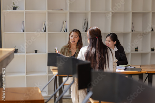 Wallpaper Mural Asian businesswoman teamwork working on laptop with finances analysis report at desk in office, business financing, accounting banking, Team of creative and business planning,  Torontodigital.ca