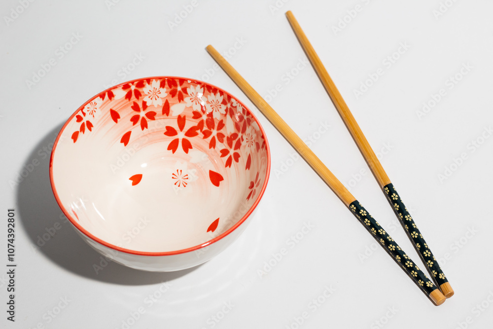 Floral pattern of chinese bowl and chopsticks on white background Floral pattern of chinese bowl and chopsticks on white background