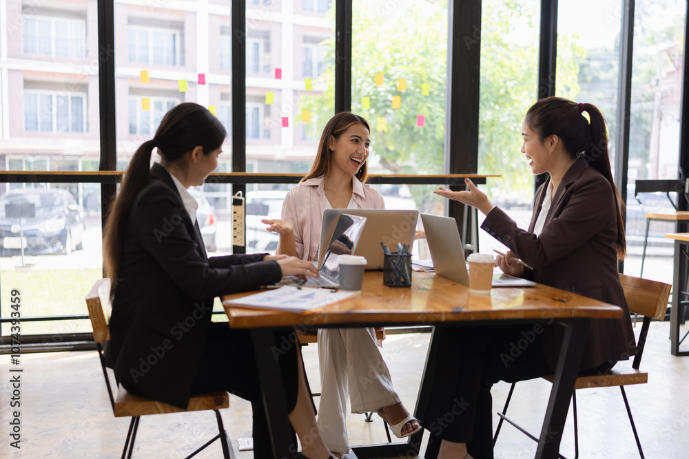 Technology and financial advisory services concept. Businesswoman teamwork and working on digital laptop computer with advisor showing plan of investment to clients at table office. Digital marketing. Technology and financial advisory services concept. Businesswoman teamwork and working on digital laptop computer with advisor showing plan of investment to clients at table office. Digital marketing.
