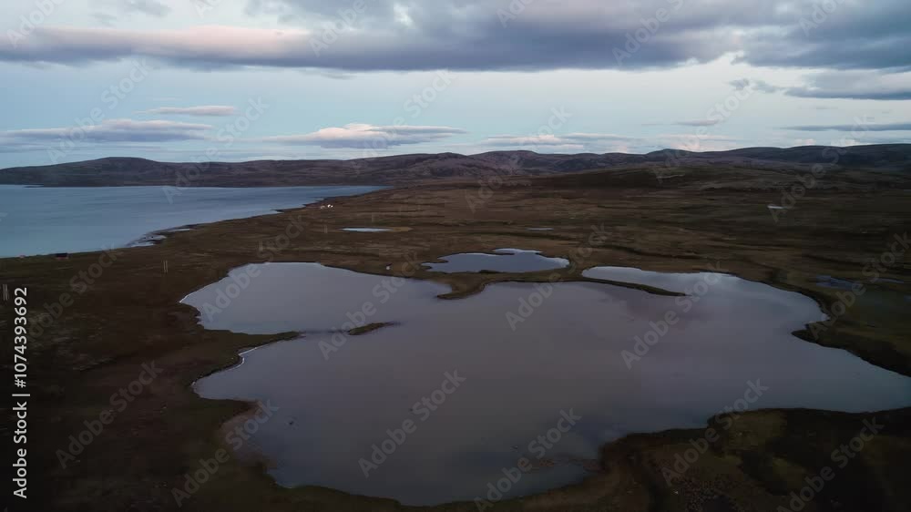 Panorama of northern Norway, lakes and hills in delicate, pastel tones Panorama of northern Norway, lakes and hills in delicate, pastel tones