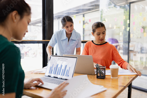 Technology and financial advisory services concept. Businesswoman teamwork and working on digital laptop computer with advisor showing plan of investment to clients at table office. Digital marketing.
