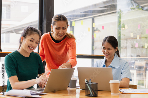 group of asian businesswoman working on laptop with finances analysis report at desk in office, business financing, accounting banking, Team of creative and business planning, 