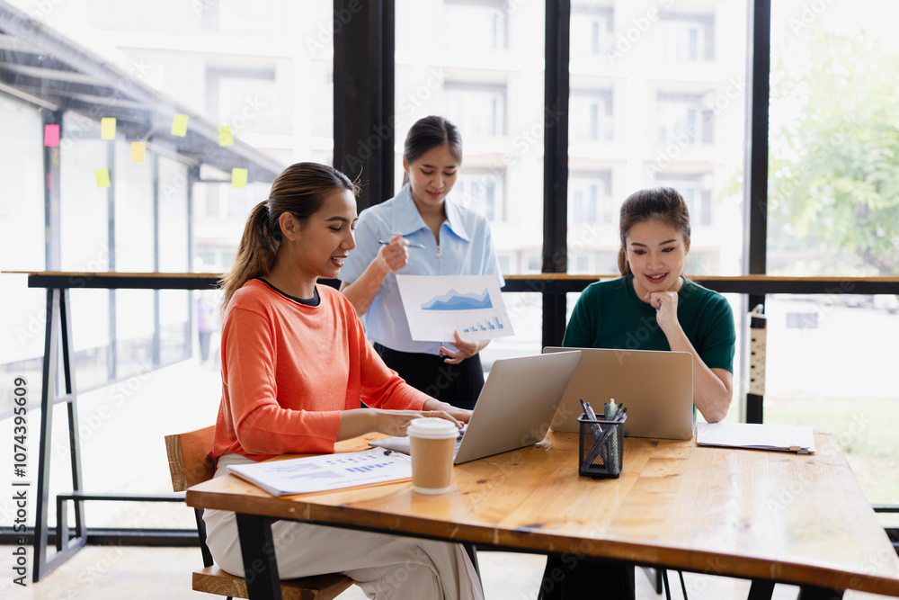 group of asian businesswoman working on laptop with finances analysis report at desk in office, business financing, accounting banking, Team of creative and business planning, group of asian businesswoman working on laptop with finances analysis report at desk in office, business financing, accounting banking, Team of creative and business planning,