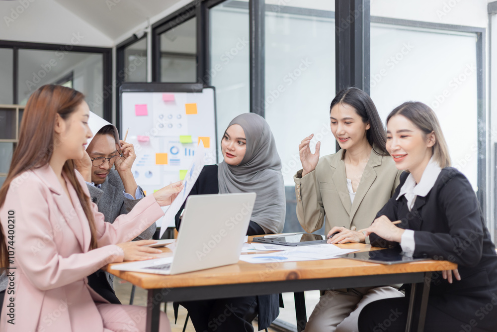 Team of Asian business people and working together in office, Startup projects and business presentation at meeting room. Team of Asian business people and working together in office, Startup projects and business presentation at meeting room.