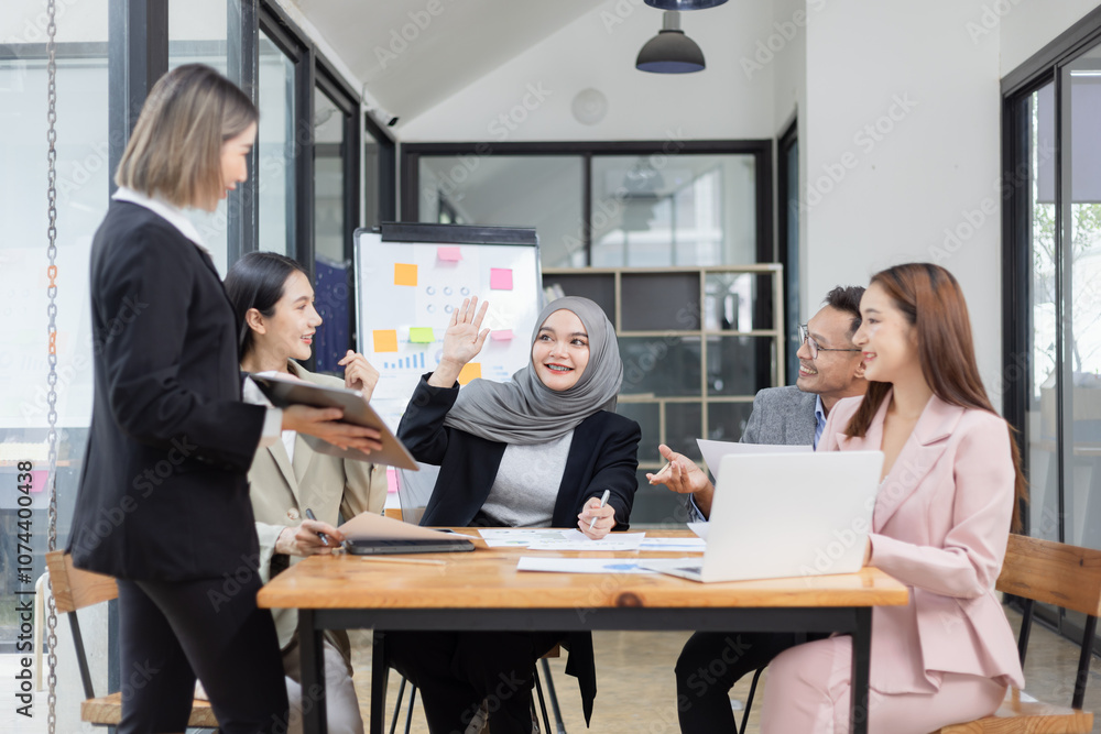 Team of Asian business people and working together in office, Startup projects and business presentation at meeting room. Team of Asian business people and working together in office, Startup projects and business presentation at meeting room.
