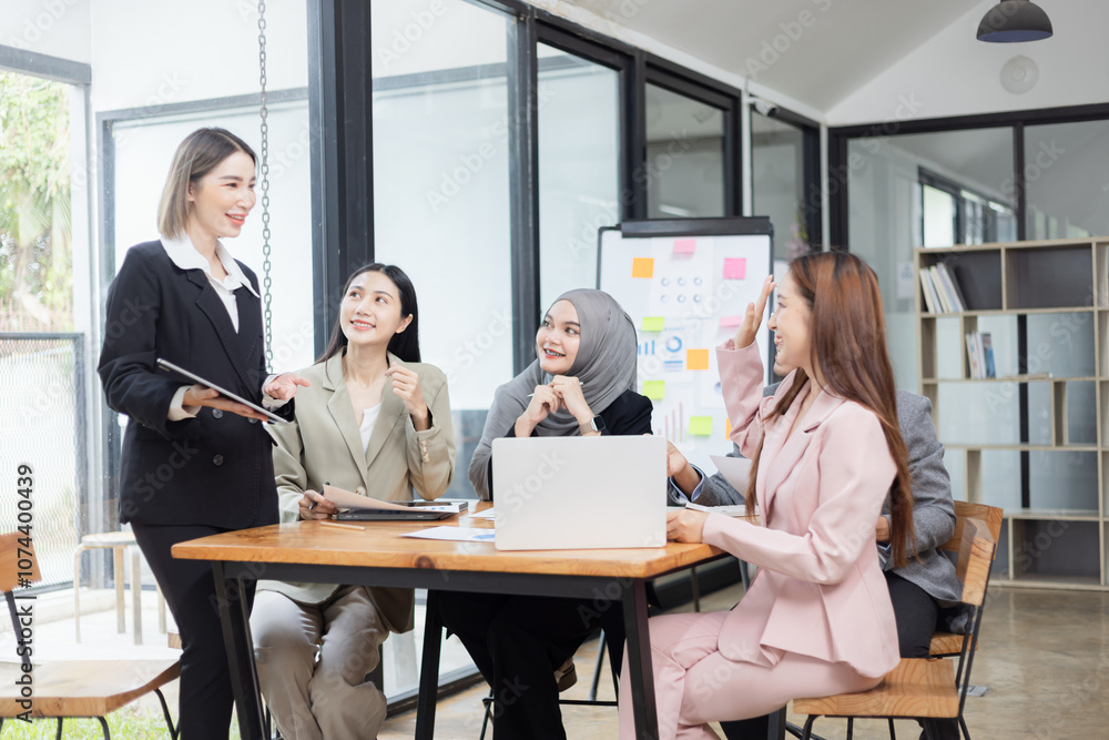 Team of Asian business people and working together in office, Startup projects and business presentation at meeting room. Team of Asian business people and working together in office, Startup projects and business presentation at meeting room.