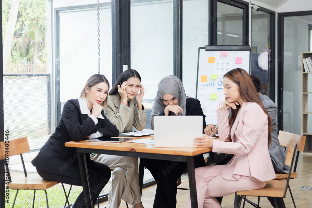 Team of Asian business people and working together in office, Startup projects and business presentation at meeting room. Team of Asian business people and working together in office, Startup projects and business presentation at meeting room.