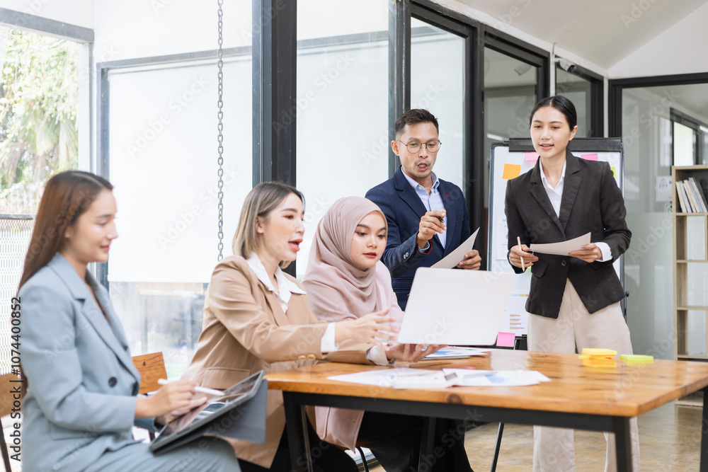 Team of Asian business people and working together in office, Startup projects and business presentation at meeting room. Team of Asian business people and working together in office, Startup projects and business presentation at meeting room.