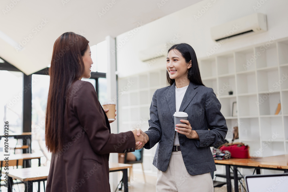 Asian businesswoman making handshake with partner in meeting room, Greeting and corporate business handshake, Asian businesswoman making handshake with partner in meeting room, Greeting and corporate business handshake,