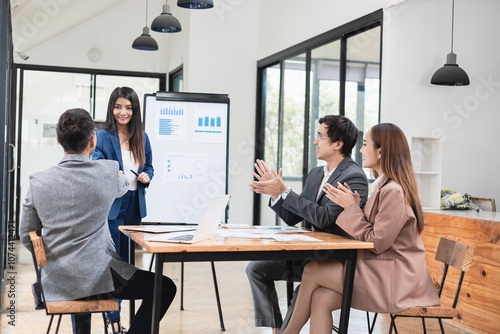 Asian business teamwork working with analysis report and advisor showing plan, Financial analysis and Marketing teamwork concept.