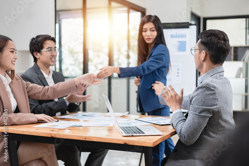 Asian business teamwork working with analysis report and advisor showing plan, Financial analysis and Marketing teamwork concept.