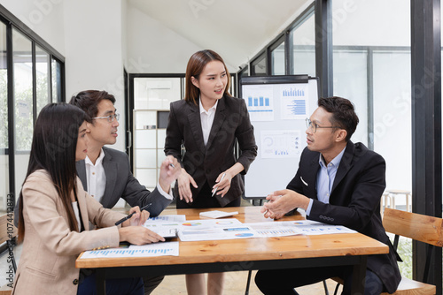 Asian business teamwork working with analysis report and advisor showing plan, Financial analysis and Marketing teamwork concept.