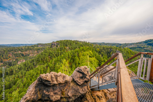 Hiking to Maria or Mariina skala wooden viewpoint built on a rock. It offers a beautiful view of the town of Jetrichovice in Bohemian Switzerland photo