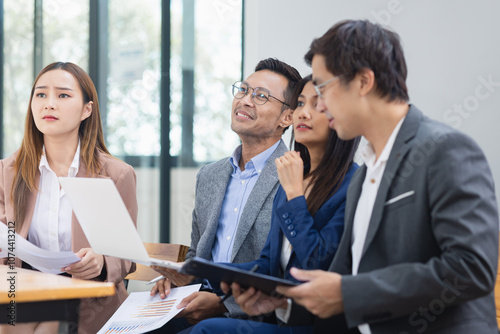 Asian business teamwork working with analysis report and advisor showing plan, Financial analysis and Marketing teamwork concept.