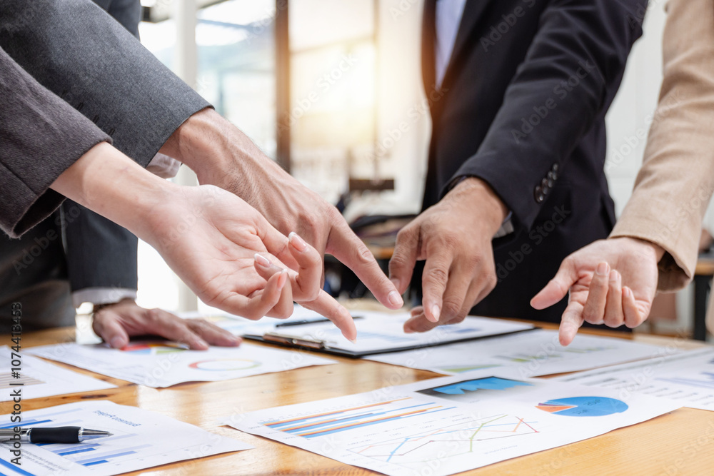 Asian business teamwork working with analysis report and advisor showing plan, Financial analysis and Marketing teamwork concept. Asian business teamwork working with analysis report and advisor showing plan, Financial analysis and Marketing teamwork concept.