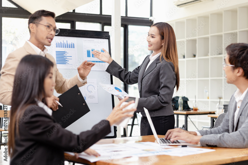 Asian business teamwork working with analysis report and advisor showing plan, Financial analysis and Marketing teamwork concept. Asian business teamwork working with analysis report and advisor showing plan, Financial analysis and Marketing teamwork concept.