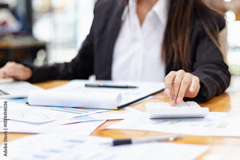 Hands of business working on a calculator at desk in office, Business accounting concept, Hands of business working on a calculator at desk in office, Business accounting concept,