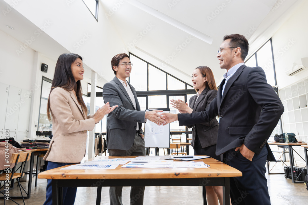 Asian business teamwork working with analysis report and advisor showing plan, Financial analysis and Marketing teamwork concept. Asian business teamwork working with analysis report and advisor showing plan, Financial analysis and Marketing teamwork concept.
