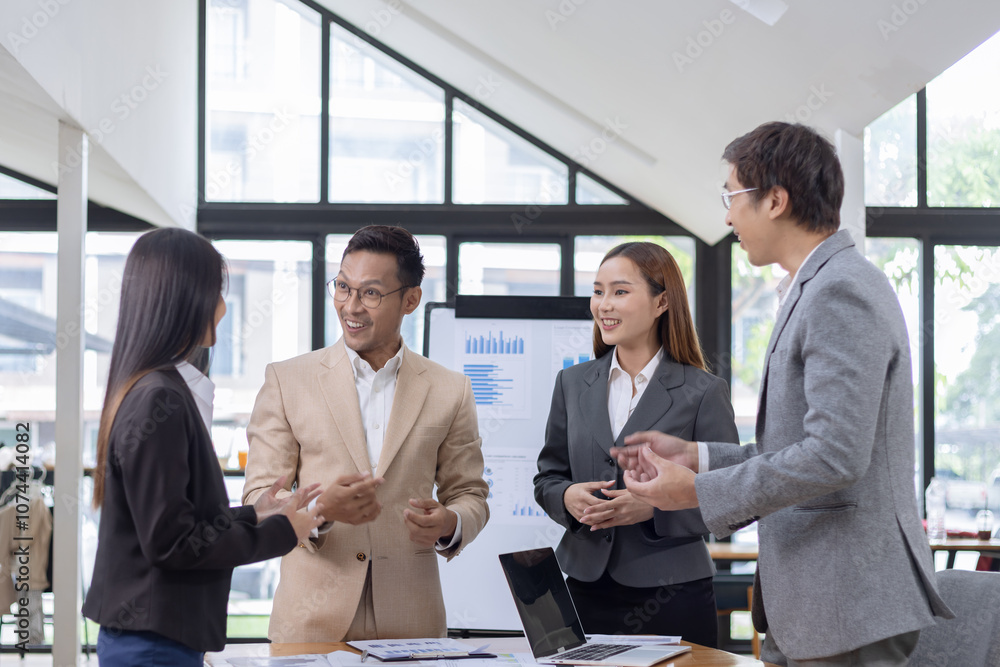 Asian business teamwork working with analysis report and advisor showing plan, Financial analysis and Marketing teamwork concept. Asian business teamwork working with analysis report and advisor showing plan, Financial analysis and Marketing teamwork concept.