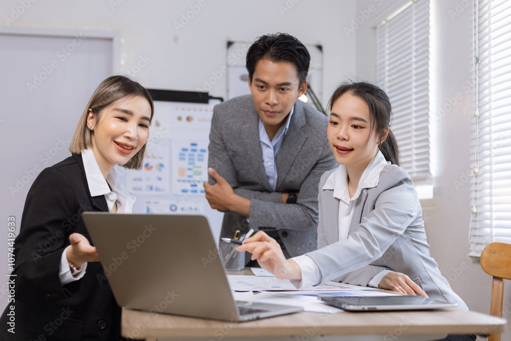 Asian business teamwork working on digital tablet with analysis report and advisor showing plan, Financial analysis and Marketing teamwork concept. Asian business teamwork working on digital tablet with analysis report and advisor showing plan, Financial analysis and Marketing teamwork concept.