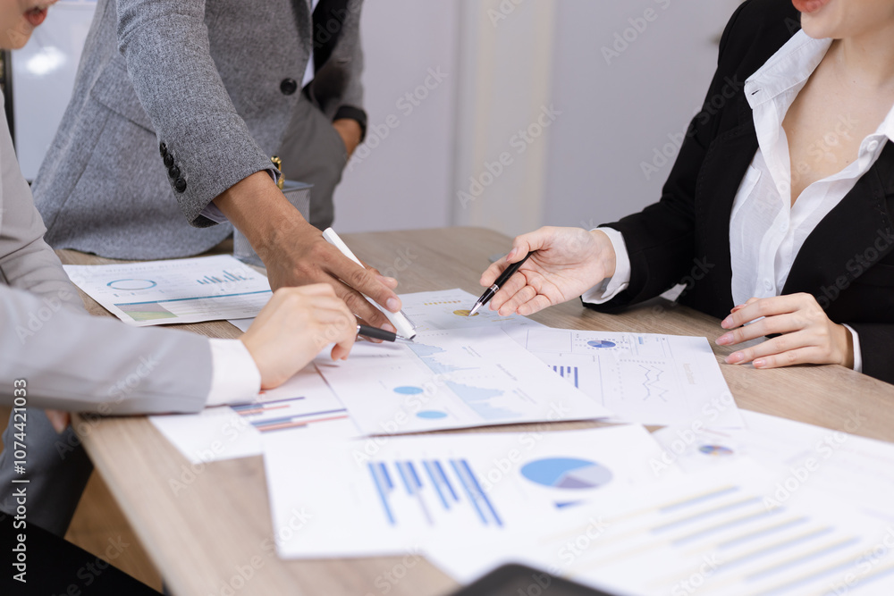 Asian business teamwork working on digital tablet with analysis report and advisor showing plan, Financial analysis and Marketing teamwork concept. Asian business teamwork working on digital tablet with analysis report and advisor showing plan, Financial analysis and Marketing teamwork concept.