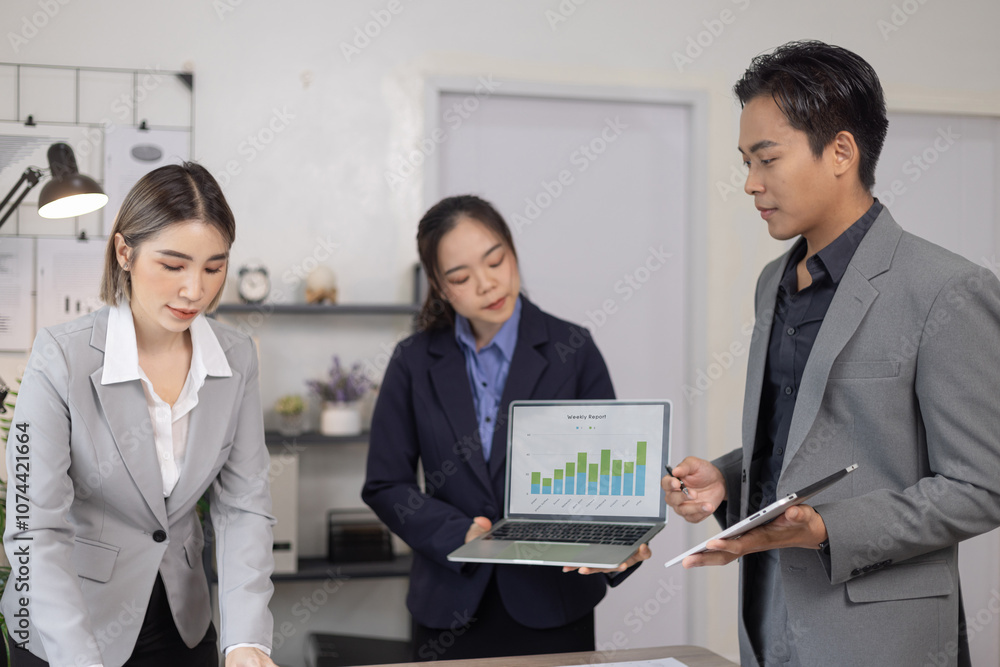 Asian business teamwork working on digital tablet with analysis report and advisor showing plan, Financial analysis and Marketing teamwork concept. Asian business teamwork working on digital tablet with analysis report and advisor showing plan, Financial analysis and Marketing teamwork concept.
