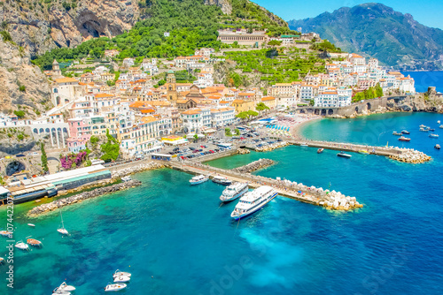 Amalfi on Amalfi Coast, Italy. Aerial photo of famous city Amalfi located on Amalfi Coast with blue sea water and beautiful colorful houses on the cliff