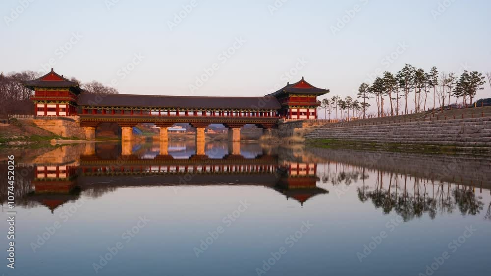 Gyeongju, South Korea. Time-lapse of a famous Woljeonggyo bridge in Gyeongju, South Korea during a sunset with reflection in the water Gyeongju, South Korea. Time-lapse of a famous Woljeonggyo bridge in Gyeongju, South Korea during a sunset with reflection in the water