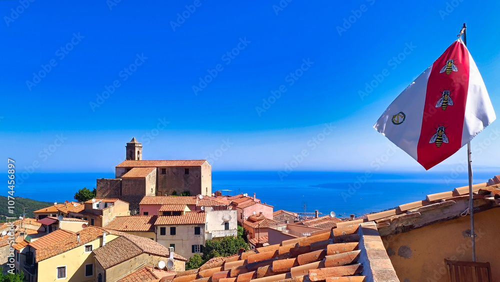 Scenic view of the italian village of Poggio on Elba with Napoleon’s flag
