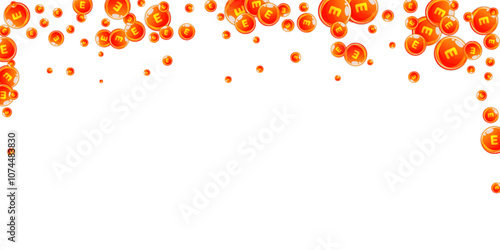 Vitamin E round capsules scattered randomly.