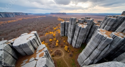 Manpupuner Rock Formations, Russia, giant stone pillars rising from green forested landscape under natural light. Captured with Nikon D850, showcasing remote and unique rock formations. photo