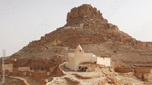 Ancient stone houses and on the mountain slopes in the Guermassa region. South Tunisia. Tatouine governorate; Tunisia. High quality 4k footage photo