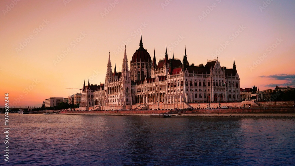 Obraz premium City summer sunset landscape, panorama, banner - top view of the Hungarian Parliament Building and Danube river with Margaret Bridge in the historical center of Budapest, in Hungary 