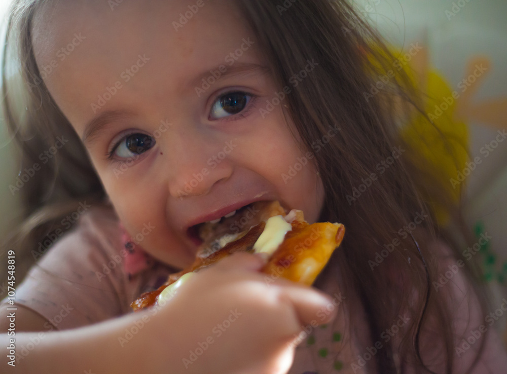 pizza with vegetables and a portrait of a baby biting pieces of pizza pizza with vegetables and a portrait of a baby biting pieces of pizza