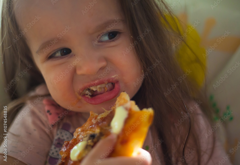 pizza with vegetables and a portrait of a baby biting pieces of pizza pizza with vegetables and a portrait of a baby biting pieces of pizza