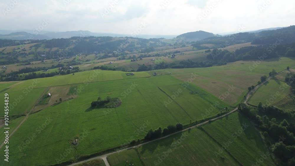 Countryside village with homes and vast green fields Countryside village with homes and vast green fields