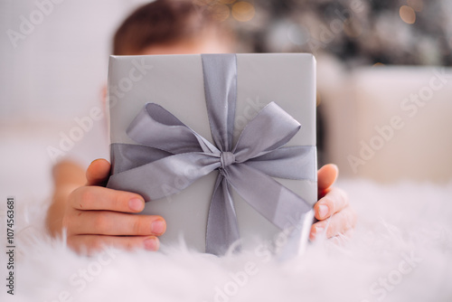 child holding christmas present