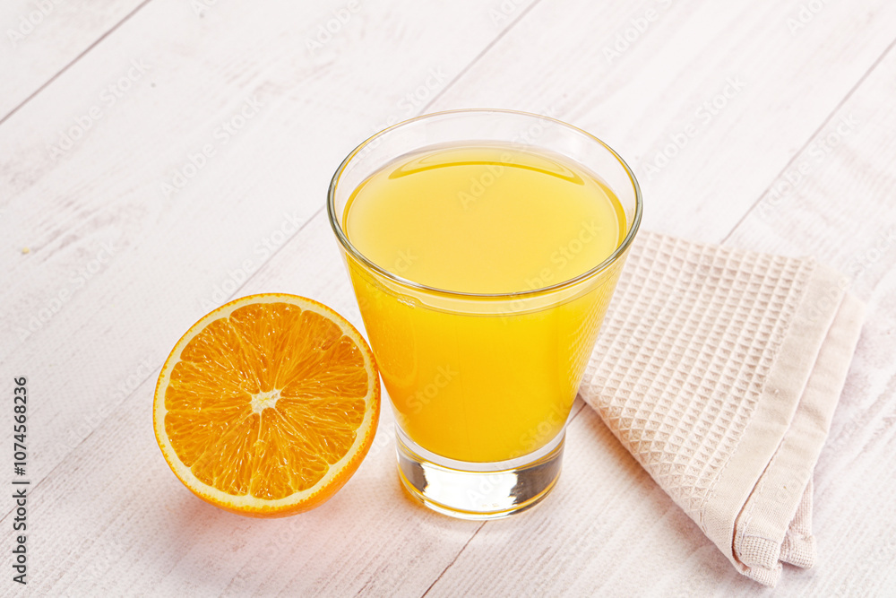 Sweet fresh orange juice in the glass Sweet fresh orange juice in the glass