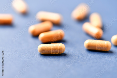 Lutein capsules. Dietary supplement on bright background. Soft focus. Close up. Copy space photo