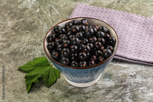 Ripe black currant in the bowl