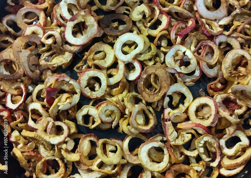 Dried apples in rings on a black background