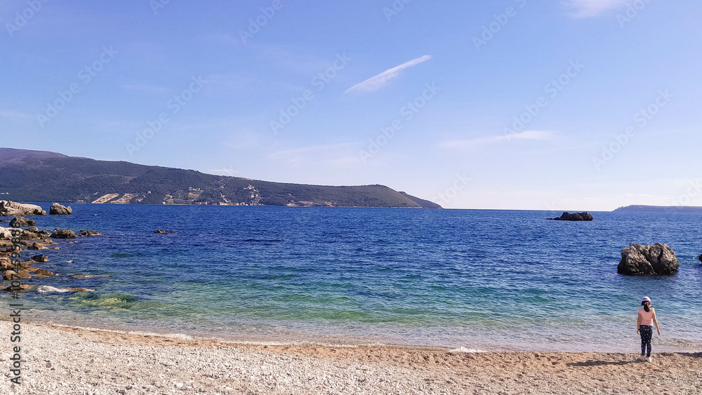 Girl relaxing on sea coast in Montenegro Girl relaxing on sea coast in Montenegro