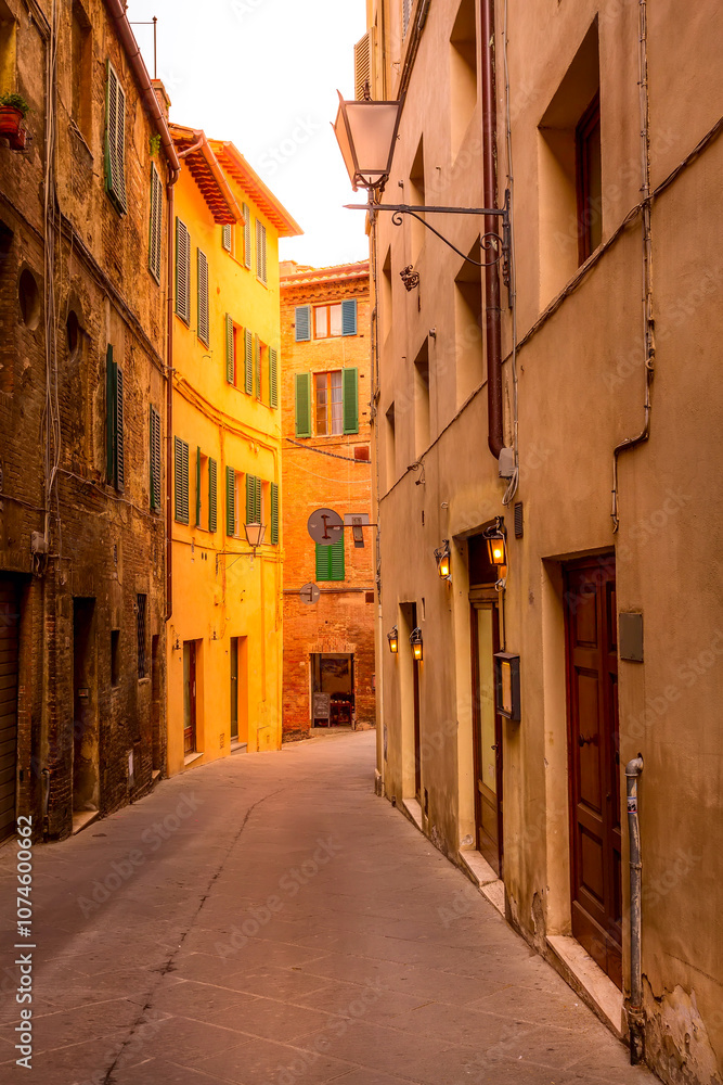 Street view in Siena, Italy with medieval houses Street view in Siena, Italy with medieval houses