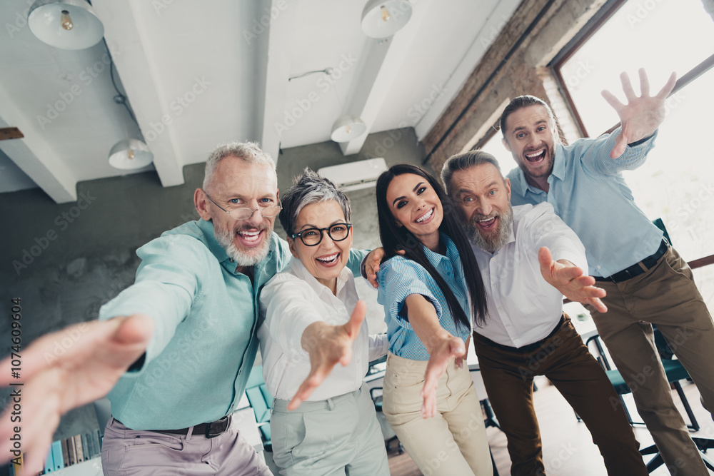 Obraz premium Photo low view of teamwork people working together stretch hands hello welcome comfortable modern office room interior indoors workspace