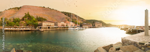 Panoramic sunrise in the ancient harbour of Behramkale. The beautiful touristic coast in the North Aegean. Canakkale province. Turkey.  photo