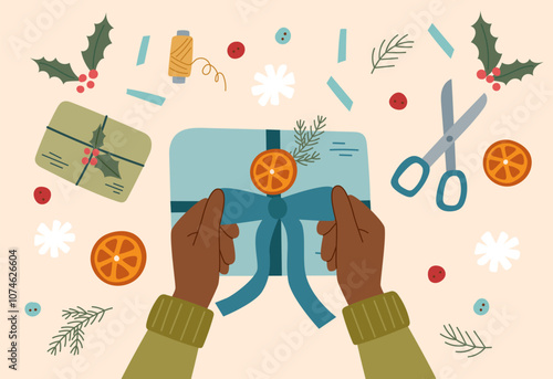Sustainable Christmas concept. Eco friendly packaging of Christmas gift. Hands wrapping a Christmas present.