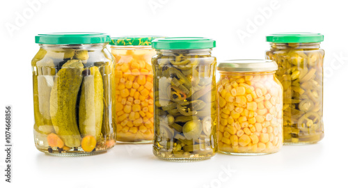 Canned vegetable. Pickled corn, cucumbers and jalapeno peppers isolated on white background.